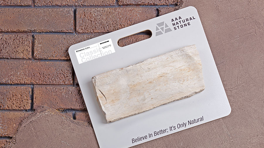 triple a natural stone sample board with rounded corners. A piece of natural stone is adhered to it with the product label in the upper left hand corner and triple a logo in the upper right hand corner. tagline believe in better it's only natural is centered across the bottom close to the bottom edge.