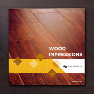 Cover of a Crossville brochure titled “Wood Impressions.” The design features a close-up of wood-look porcelain tile flooring with a geometric yellow and white overlay band near the bottom. The Crossville logo appears alongside the tagline “Elevate Your Environment.”