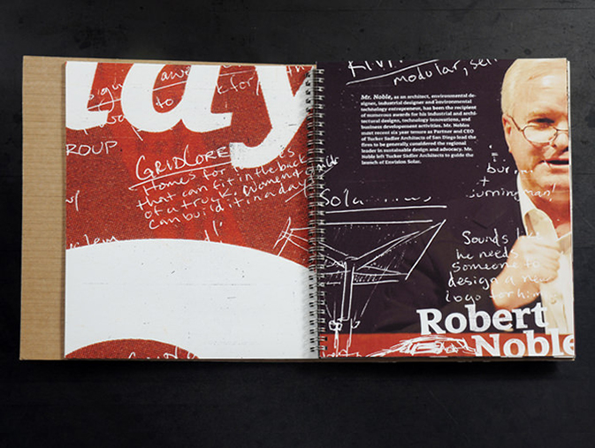 An open spiral-bound booklet from the AIGA Y13 Conference, featuring a dynamic two-page spread. The left page displays a red and white abstract background with handwritten white notes scribbled across. The right page includes a photo of environmental designer Robert Noble, overlaid with sketches and notes about solar design and modular structures. His name appears prominently at the bottom, suggesting this spread is a speaker or feature profile. The visual style conveys innovation, brainstorming, and sustainable design thinking.