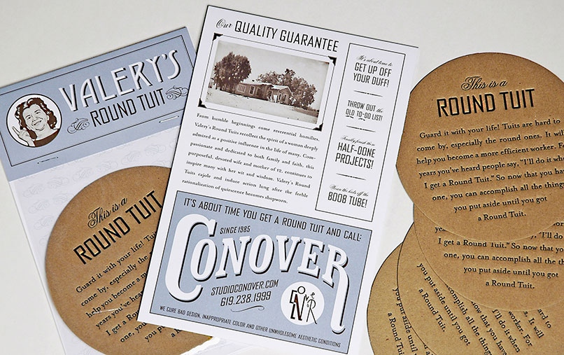A humorous promotional print set titled “Round Tuit” by StudioConover. The materials include circular brown cards labeled “This is a Round Tuit” with playful motivational text, a retro-style flyer featuring a home photo and satirical slogans like “Get Up Off Your Duff,” and a branded card urging people to finally tackle procrastinated projects. A smaller piece labeled “Valery’s Round Tuit” is also included.