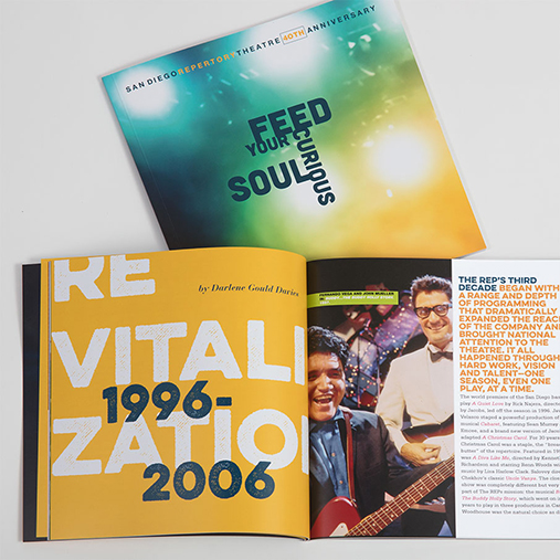A colorful booklet for San Diego REP Theatre’s anniversary celebration. The cover features a vibrant gradient background with the tagline “FEED YOUR CURIOUS SOUL” in bold black text. The open spread inside shows the word “REVITALIZATION 1996–2006” in large yellow and white letters, along with a photo of performers with guitars and a column of text on the right recounting the theater's history.